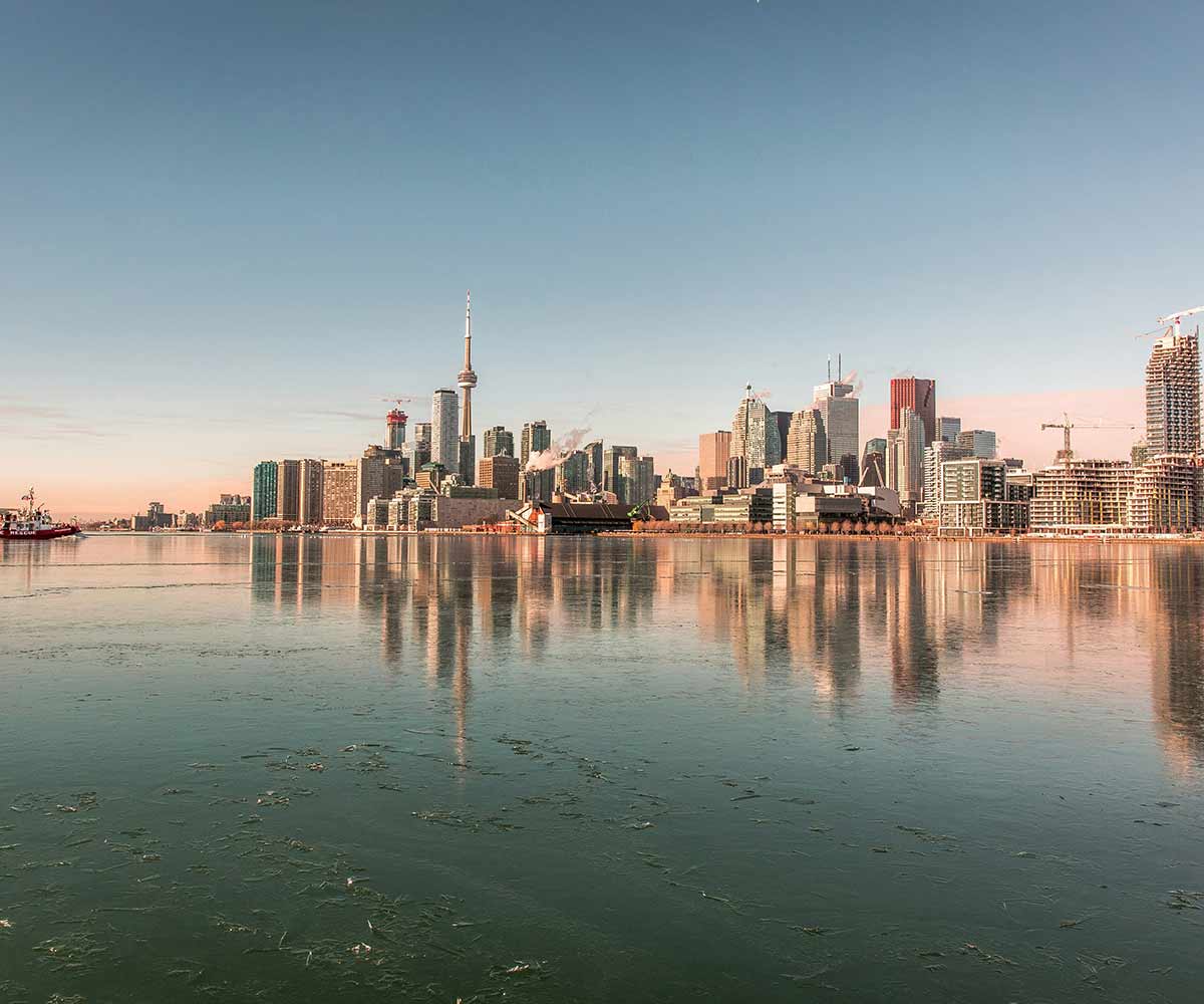 The Toronto skyline across the water at dusk