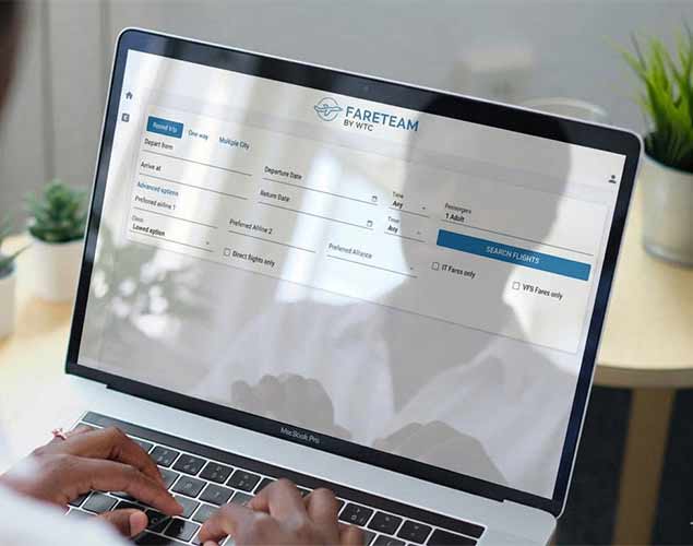 The Fareteam flight search form open on a laptop
